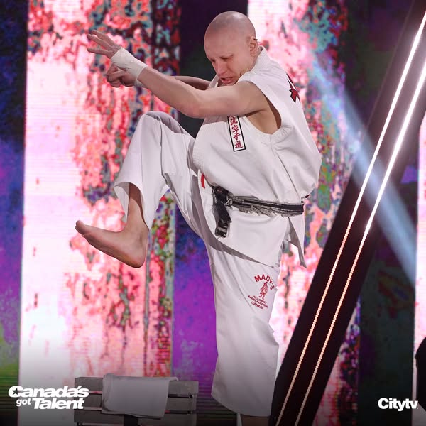 Chucky Mady raising his knee above a stack of concrete blocks during his 2022 Canada’s Got Talent semi-final performance