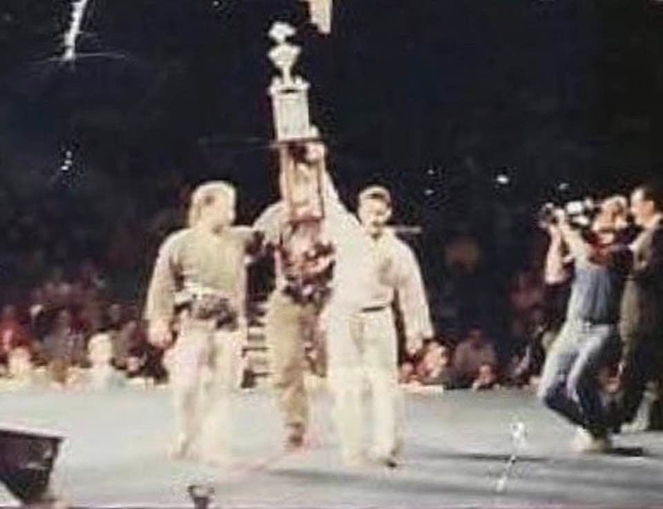 An archival trophy presentation at a martial arts event