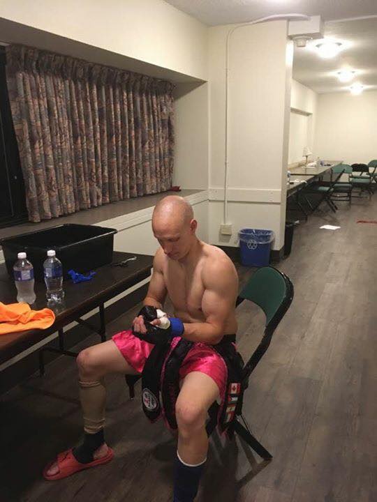 Fighter resting while wearing protective gloves