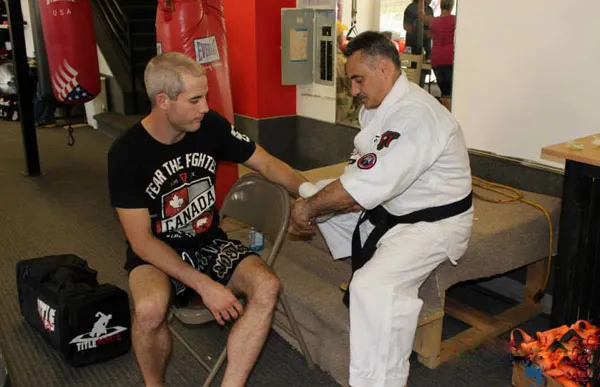 Albert demonstrating a technique with a training partner