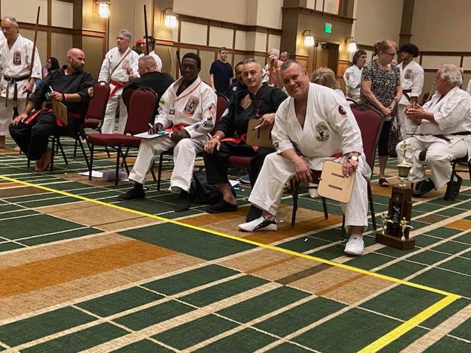 Karate competitor taking a fighting stance at a tournament