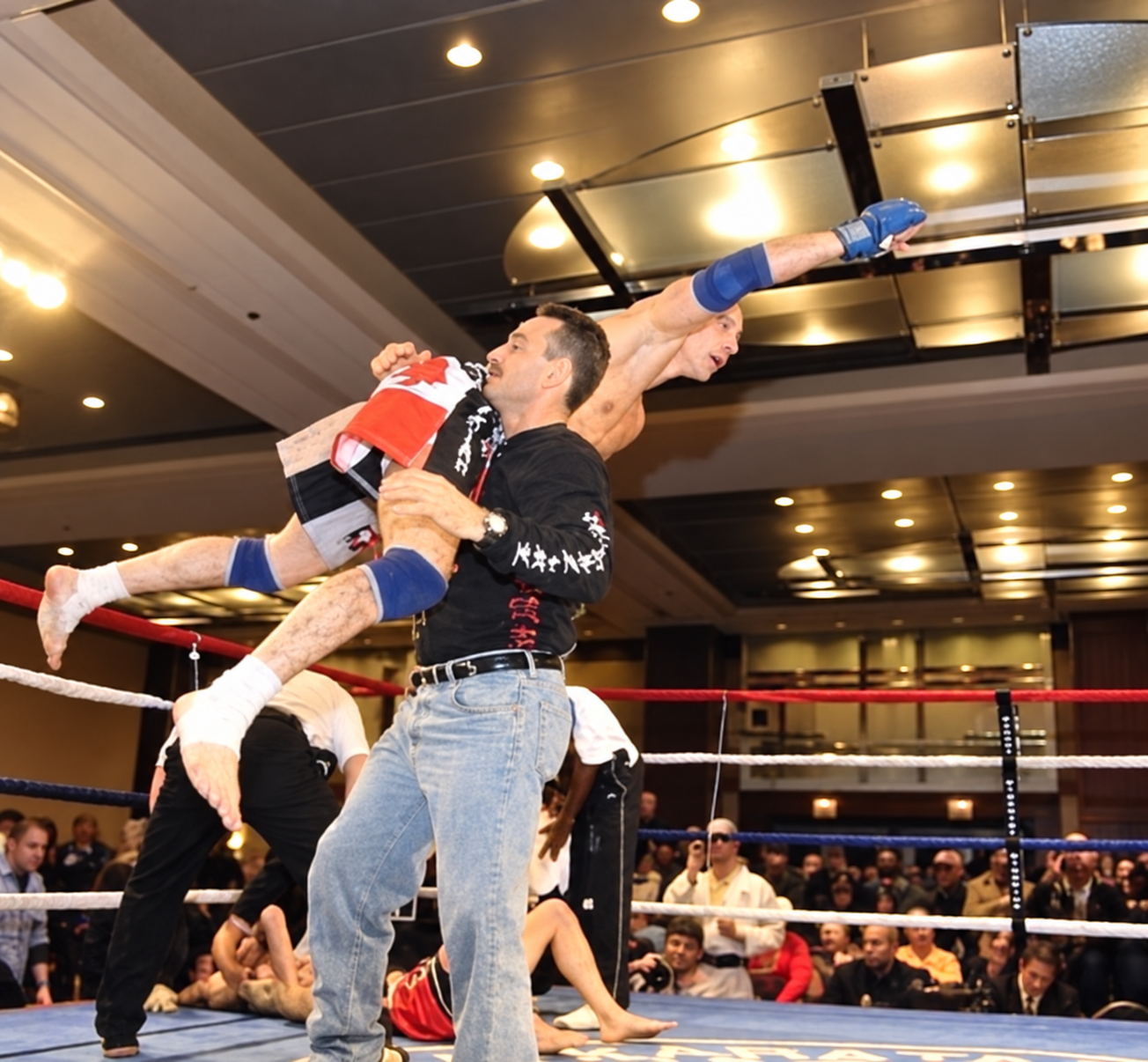 Full-contact martial arts action inside the ring